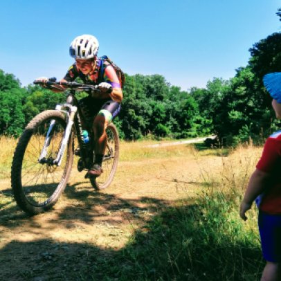 Caitlin Thompson races Granogue under the watchful cheering eye of her daughter, 2018.